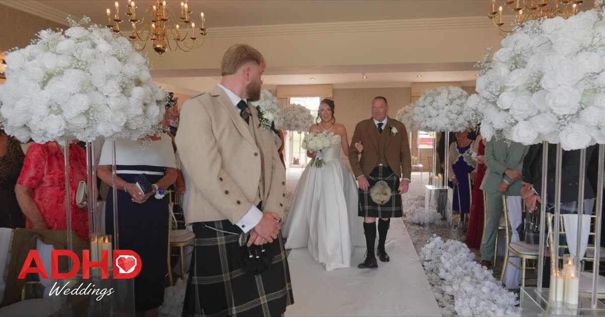 A bride walking down the aisle towards her partner during a wedding filmed by ADHD Weddings